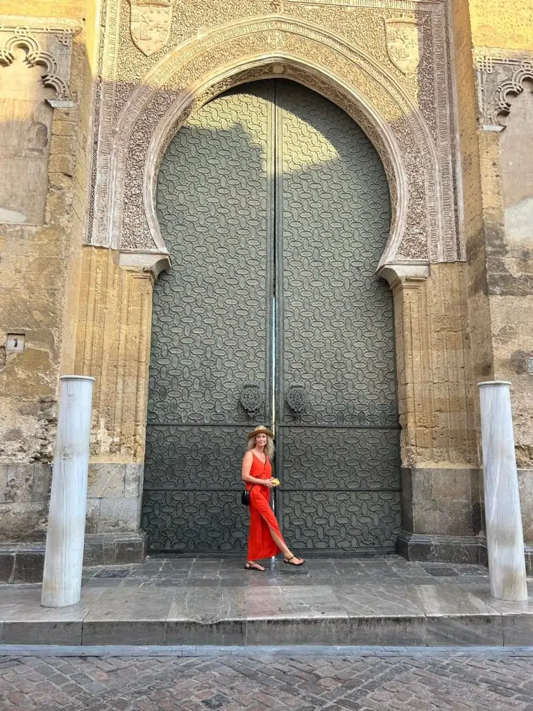 Author Lucy Reed in front of the cathedral gates in Cordoba